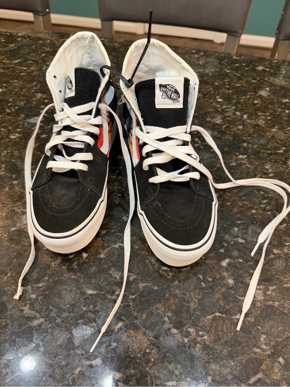 Vans women’s  Black High-Top Sneakers with White Laces and Side Flame Accent